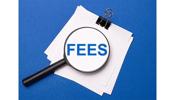 the word fees under a magnifying glass