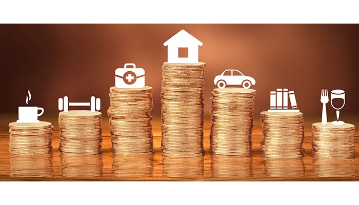 stacks of coins with icons to illustrate acceptable loan uses